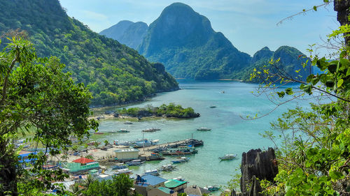 Scenic view of bay against mountains