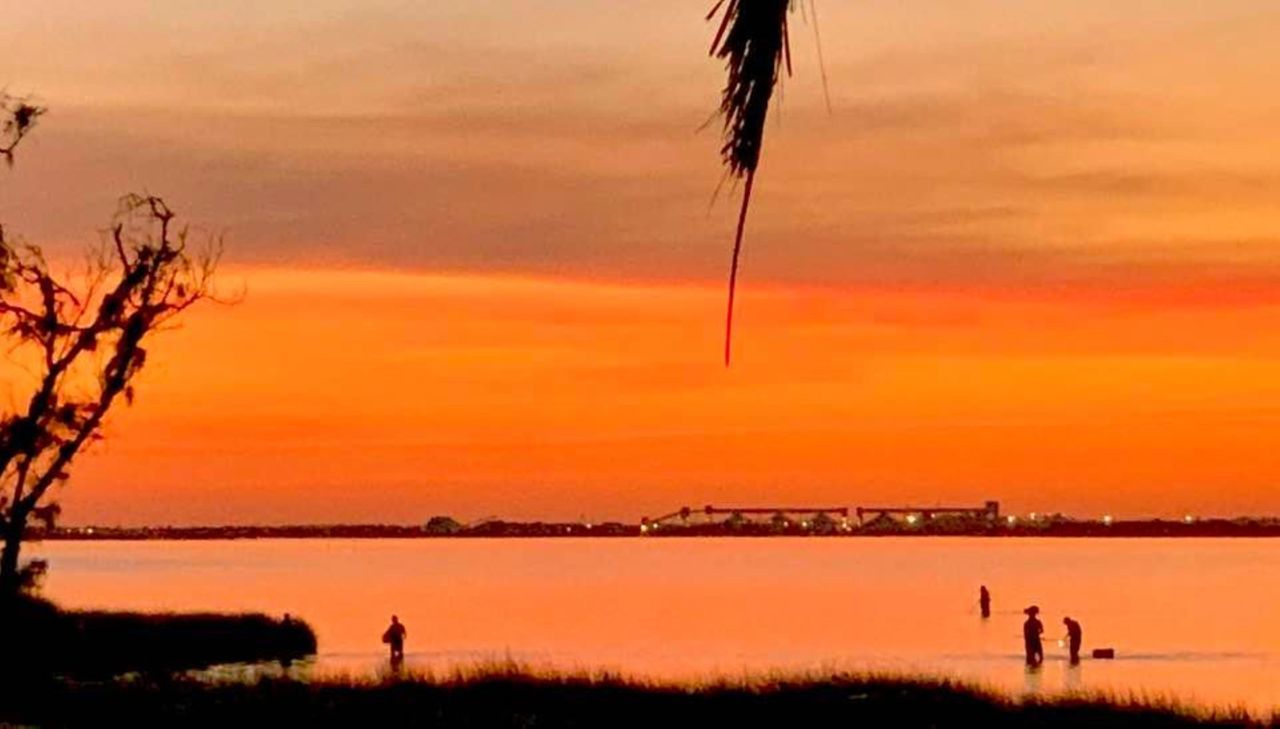 SCENIC VIEW OF SEA AGAINST ORANGE SKY