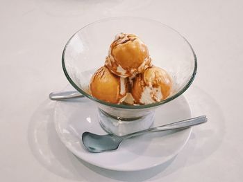 Ice cream in glass on table