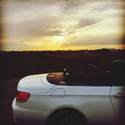 Close-up of road against sunset sky