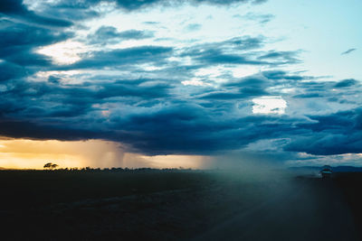 Aerial view of landscape against cloudy sky