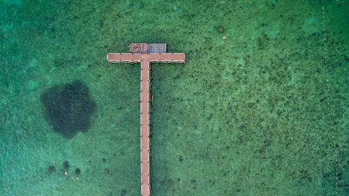 High angle view of information sign on green pole