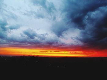 Scenic view of dramatic sky during sunset