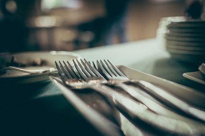 Close-up of chairs and table in restaurant