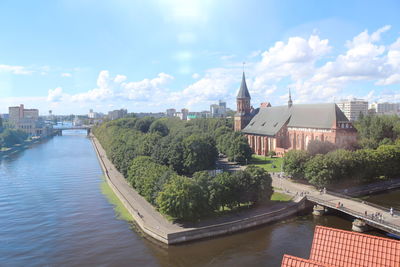 Panoramic view of river and buildings against sky