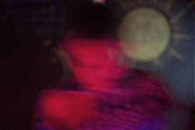 Close-up portrait of woman at night