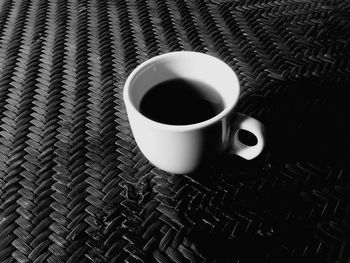 High angle view of black coffee on table