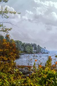 Scenic view of sea against cloudy sky