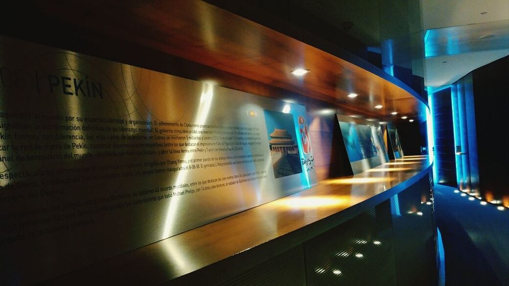 indoors, illuminated, architecture, built structure, modern, reflection, night, lighting equipment, transportation, light - natural phenomenon, no people, building, incidental people, city, empty, ceiling, in a row, building exterior, absence, light