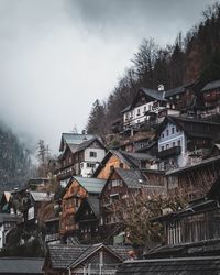 Buildings in city against sky during winter