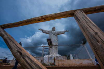 Low angle view of statue against sky