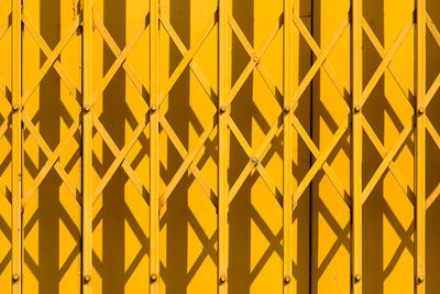 Full frame shot of yellow steel security fencing