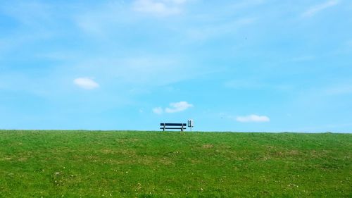 Built structure on field against sky