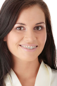 Close-up portrait of a smiling young woman