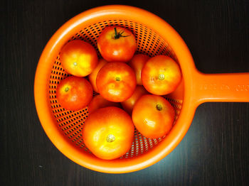 High angle view of oranges in bowl on table