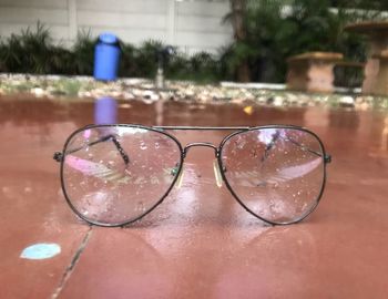 Close-up of sunglasses in swimming pool