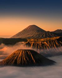 Scenic view of mountain range against sky during sunset