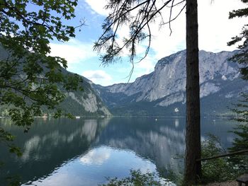 Scenic view of lake and mountains against sky