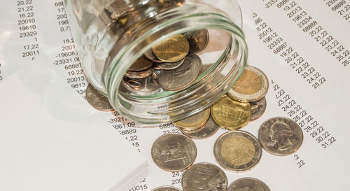 High angle view of coins on table