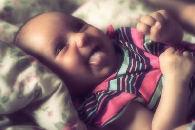 Close-up portrait of baby sleeping on bed