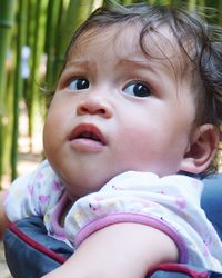 Close-up of girl looking up outdoors