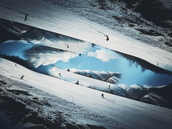 Scenic view of snow covered mountains against sky