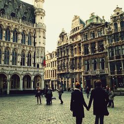 Tourists in front of building