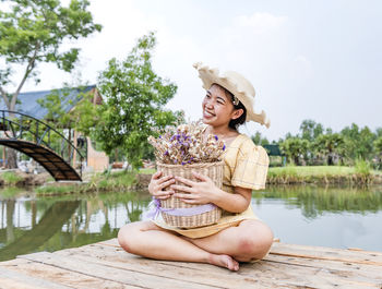 Happy woman enjoying the beautiful nature around her - woman concept and healthy natural lifestyle 