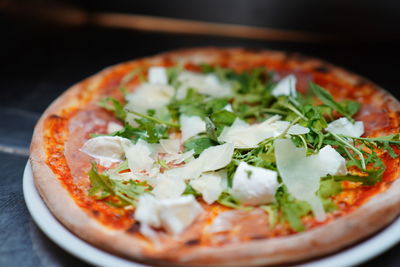 Close-up of pizza served in plate