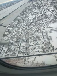 Aerial view of snow through glass window