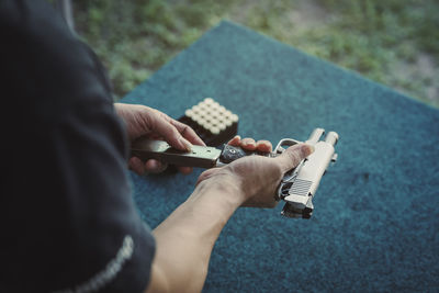 Cropped hand of man holding toy