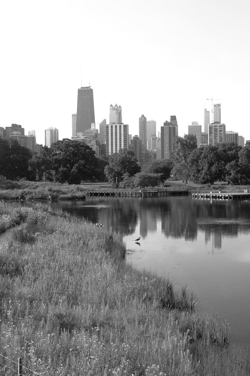 RIVER AND BUILDINGS AGAINST SKY