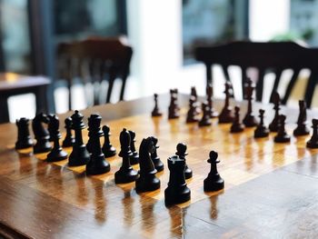 Close-up of chess pieces on table