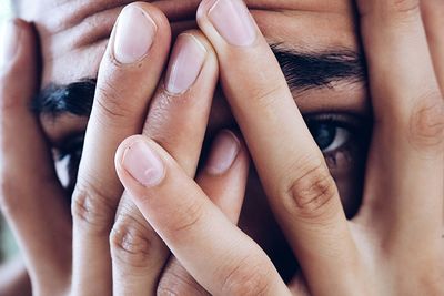 Close-up of person covering face