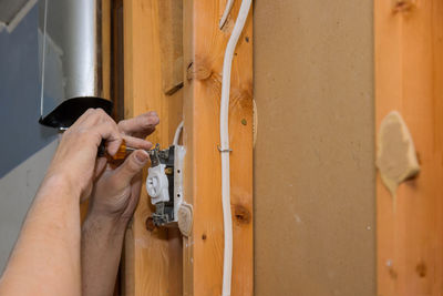 Cropped hand of man working at workshop