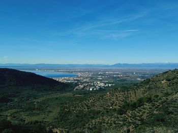 High angle view of cityscape against blue sky