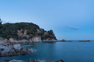 Scenic view of sea against blue sky