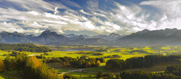 Scenic view of landscape and mountains against sky