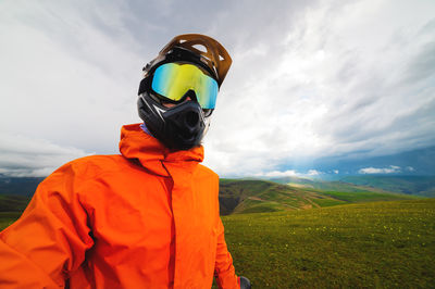 Rear view of man standing against sky