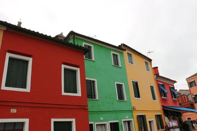 Low angle view of colorful houses against sky