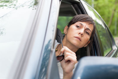 Close-up of woman in car