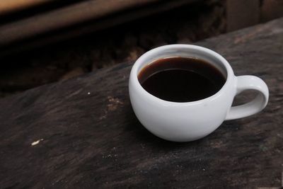 High angle view of coffee cup on table