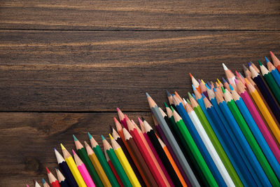 Close-up of multi colored pencils on table