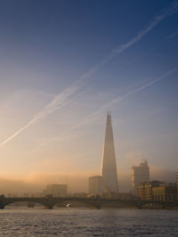 View of cityscape against sky during sunset