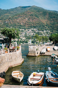 Boats moored at harbor