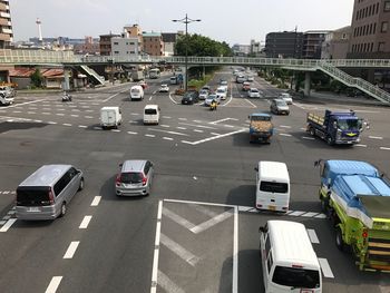 High angle view of vehicles on road in city