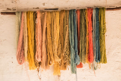 Close-up of clothes hanging on wall