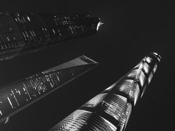 Low angle view of metallic structure against sky at night