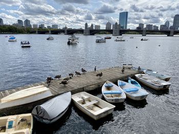 High angle view of boats moored in river against sky