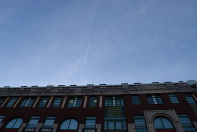 Low angle view of building against blue sky